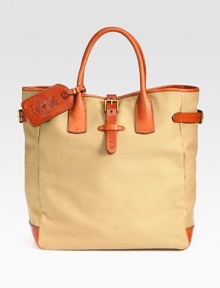 A superior carryall for daily essentials, a polished canvas bag constructed with saddle-inspired leather trim features comfortable rolled handles and interior organizational pocketing for quick access to the necessities.Double top handlesLeather strap with roller-buckle closureInterior slip A superior carryall for daily essentials, a polished canvas bag constructed with saddle-inspired leather trim features comfortable rolled handles and interior organizational pocketing for quick access to the necessities.Double top handlesLeather strap with roller-buckle closureInterior slip