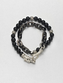 Double-strand beaded and link bracelet of sterling silver and black onyx is offset by an engraved lobster clasp.Sterling silver/stainless steelBlack onyxAbout 3 diam.Imported Double-strand beaded and link bracelet of sterling silver and black onyx is offset by an engraved lobster clasp.Sterling silver/stainless steelBlack onyxAbout 3 diam.Imported