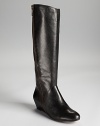 Corso Como's Doyle boots make a statuesque appearance in pebbled leather, equipped with a 2 wedge for a luxe lift.