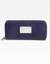 Stay organized in style with this slim continental silhouette crafted from gorgeous pebble-grain leather.Zip-around closureLogo plateCenter zip compartmentSix credit card slotsTwo inside open pocketsFully lined7½W X 4H X 1DImported