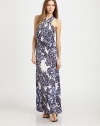 A billowing silhouette with allover rich cool tone print is perfect for warm weather style. High v-neckSleevelessFront pleated bodiceFitted skirtCrossback with ruched strapsAbout 44¾ from natural waist94% venezia/6% spandexDry cleanMade in USAModel shown is 5'9½ (176cm) wearing US size Small.
