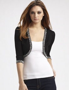 Fine gauge knit in a lavish silk/cashmere blend is trimmed with clusters of beads. Three-quarter sleeves About 14 from shoulder to hem 85% silk/15% cashmere; hand wash Imported Fine gauge knit in a lavish silk/cashmere blend is trimmed with clusters of beads. Three-quarter sleeves About 14 from shoulder to hem 85% silk/15% cashmere; hand wash Imported