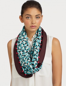 A graphic style with a fun pom-pom trim. 75% viscose/25% woolAbout 19 X 75Dry cleanImported A graphic style with a fun pom-pom trim. 75% viscose/25% woolAbout 19 X 75Dry cleanImported