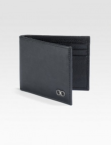 Single fold wallet rendered in luxuriously textured, Italian calfskin leather with double gancini silver ornament accent for a signature finish.One bill compartmentSix card slotsLeather4W x 3HMade in Italy Single fold wallet rendered in luxuriously textured, Italian calfskin leather with double gancini silver ornament accent for a signature finish.One bill compartmentSix card slotsLeather4W x 3HMade in Italy