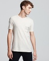 Burberry's signature check print makes an appearance on the chest pocket of this timeless, soft cotton tee.