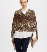 A luxuriously soft cashmere design with an eye-catching leopard print to keep you cozy.CashmereHandkerchief hemAbout 21 from shoulder to hemHand wash or dry cleanImported