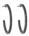 Gray matters. A hematite-tone finish adds depth and drama to CRISLU's chic hoop earrings. Crafted in sterling silver with an inside out design, they're adorned with glittering cubic zirconias (1/2 ct. t.w.). Wear them day or night for a gorgeous, glamorous look. Approximate diameter: 15/16 inch.