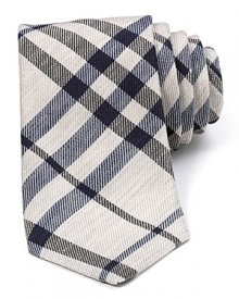 Burberry's classic check print gets a summer-style makeover in lightweight linen and silk. With navy and black tones against natural almond, this skinny tie goes best with timeless basics. Burberry's classic check print gets a summer-style makeover in lightweight linen and silk. With navy and black tones against natural almond, this skinny tie goes best with timeless basics.