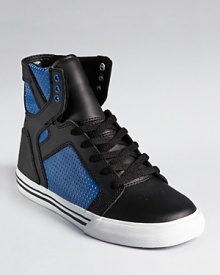 Classic high top design perched atop a authentic vulcanized sole, with blue perforation on the sides and a padded collar providing superior ankle support and comfort. Classic high top design perched atop a authentic vulcanized sole, with blue perforation on the sides and a padded collar providing superior ankle support and comfort.