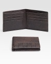 Dark brown leather with guiccissima leather trim. Six card slots Two bill compartments 4.3W X 3.8H Made in Italy 