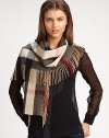 A soft, cashmere design in a mega check pattern accented with a fringe border. CashmereAbout 71 X 20Dry cleanImported 
