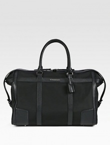 A handsome weekender that appeals to all of your travel needs, crafted in structured, all-purpose nylon with pebbled leather trim. Top zip closureTop handlesInterior zip pocketSide tab detailsProtective feet94% polyamide/6% acrylicFully lined 19½W x 12¼H x 10D Imported A handsome weekender that appeals to all of your travel needs, crafted in structured, all-purpose nylon with pebbled leather trim. Top zip closureTop handlesInterior zip pocketSide tab detailsProtective feet94% polyamide/6% acrylicFully lined 19½W x 12¼H x 10D Imported