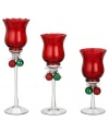 In opulent red glass, these votive holders from Ganz give a festive glow to your home this holiday season. Each holder features a duo of classic Christmas ball ornaments tied with ribbon around the stem.