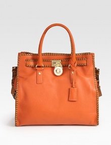 Rich pebble-grain leather in a roomy top-handle carryall finished with polished hardware and whip-stitched trim.Double top handles, 4¾Adjustable shoulder strap, 12-13 dropTop snap closureProtective metal feetOne inside zip pocketFour inside open pocketsOne inner hookCotton lining14¼W X 13H X 5½DImported Rich pebble-grain leather in a roomy top-handle carryall finished with polished hardware and whip-stitched trim.Double top handles, 4¾Adjustable shoulder strap, 12-13 dropTop snap closureProtective metal feetOne inside zip pocketFour inside open pocketsOne inner hookCotton lining14¼W X 13H X 5½DImported