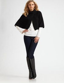 A luxurious cashmere design with a stand collar and snap closure. Stand collarElbow lengthFront snap closureAbout 15 from shoulder to hemCashmereDry cleanImported A luxurious cashmere design with a stand collar and snap closure. Stand collarElbow lengthFront snap closureAbout 15 from shoulder to hemCashmereDry cleanImported