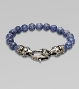 A new look for the modern man, handsomely crafted with a sterling silver raven's head clasp and a string of grey coral beads.Sterling silverLobster claspBracelet, 9 longAbout 3 diamImported