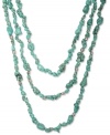 Get stranded in style. Lucky Brand's layered necklace features three rows of semi-precious turquoise stones embellished with silvery knot accents. Set in silver tone mixed metal. Approximate length: 25 inches.
