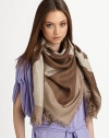 A large iconic logo print in a square style with baby fringe details. WoolAbout 50 X 50Dry cleanImported 