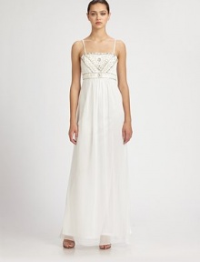 This regal, beaded design features delicate shoulder straps and a gauzy, floor-length skirt.Adjustable spaghetti strapsBeaded bodiceEmpire waistConcealed side zipFully linedAbout 45 from natural waist80% polyester/20% nylonSpot cleanImportedModel shown is 5'11 (180cm) wearing US size 4. This regal, beaded design features delicate shoulder straps and a gauzy, floor-length skirt.Adjustable spaghetti strapsBeaded bodiceEmpire waistConcealed side zipFully linedAbout 45 from natural waist80% polyester/20% nylonSpot cleanImportedModel shown is 5'11 (180cm) wearing US size 4.