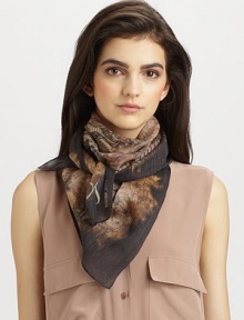 A smooth, wool and silk blend style with an intricate, legendary print.About 34 X 3762% wool/38% silkDry cleanImported A smooth, wool and silk blend style with an intricate, legendary print.About 34 X 3762% wool/38% silkDry cleanImported