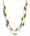 Layers of golden accents stack up classic style on Charter Club's four-row necklace. Finished with a toggle closure. Crafted in brushed gold tone mixed metal. Approximate length: 18 inches. Approximate drop: 3/4 inch.