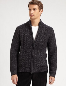 A chunky zippered cardigan featuring bold cable-knit details and a cool mockneck collar.Mockneck collarZip frontLong sleevesFront slash pocketsRibbed details at collar, cuffs, pockets and hem70% acrylic/18% cotton/12% polyesterDry cleanImported