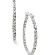 An elegant addition. These sterling silver hoop earrings from Victoria Townsend feature sparkling diamonds (1/4 ct. t.w.) for a stunning effect in any formal occasion. Approximate diameter: 1-1/8 inches.