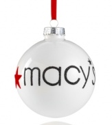 Find your holiday magic at Macy's with this simple ball ornament, featuring radiant white glass with glittery embellishment.