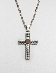 This classic, sterling silver cross pendant is adorned with labradorite, lending a touch of modern elegance.Sterling silverLabradoriteAbout 20 long; Pendant: about 1 x 1½ diam.Imported