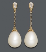 Sophisticated style perfect for the office or an evening out. Elegant drops feature cultured freshwater pearls (8 x 11 mm) strung from delicate chains crafted in 14k gold with sparkling diamond-accented posts. Approximate drop: 1-1/10 inches.