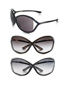 Oversized plastic frame holds a floating lens. Available in black with grey lens, dark brown with brown lens, dark grey with grey lens or transluscent red with brown lens. UV 400 lens 100% UV protective Made in Italy Oversized plastic frame holds a floating lens. Available in black with grey lens, dark brown with brown lens, dark grey with grey lens or transluscent red with brown lens. UV 400 lens 100% UV protective Made in Italy