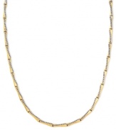 Golden and glamorous, this stylish X-patterned necklace dazzles with diamond accents. Crafted from 14k gold. Approximate length: 17 inches. Approximate width: 1/8 inch.