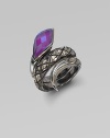 From the Queen Cobra Collection. A sensuous snake with textured scales of sterling silver and a faceted head of purple sugalite coils its way alluringly around the finger. Purple sugalite and hematite Sterling silver Width, about 1 Imported