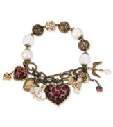 Quite charming. Betsey Johnson's half stretch charm bracelet, is crafted from gold- and hematite-tone mixed metal with glass pearls and glistening accents for a whimsical touch. Item comes packaged in a signature Betsey Johnson Gift Box. Approximate length: 7-1/2 inches.