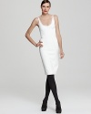 This minimalist Donna Karan New York sheath dress is elegantly tailored with artful piping to create a stunning, molded shape, while a back two-way zipper lends unexpected allure.