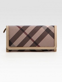 Stay organized in this sleek flap-front silhouette crafted in signature check canvas with leather trim.Flap snap closureOne outside open pocket under flapFour outside credit card slots under flapOne inner top-zip pocketTwo inner compartmentsTen credit card slotsThree inside open pocketsFully lined7½W X 4H X 1DImported Stay organized in this sleek flap-front silhouette crafted in signature check canvas with leather trim.Flap snap closureOne outside open pocket under flapFour outside credit card slots under flapOne inner top-zip pocketTwo inner compartmentsTen credit card slotsThree inside open pocketsFully lined7½W X 4H X 1DImported