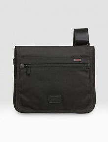 This slim, sleek design works well for carrying your essentials during travel or everyday use. Made from rugged ballistic nylon, it can be worn over the shoulder or across the body. Magnetic flap closure Adjustable shoulder strap Interior, exterior accessories pockets 11W X 12¼H X 1¾D Imported This slim, sleek design works well for carrying your essentials during travel or everyday use. Made from rugged ballistic nylon, it can be worn over the shoulder or across the body. Magnetic flap closure Adjustable shoulder strap Interior, exterior accessories pockets 11W X 12¼H X 1¾D Imported