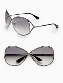 Oversized crossover metal frame with open temple and floating lens. Available in shiny gunmetal with smoke gradient lens.100% UV protection Made in Italy Oversized crossover metal frame with open temple and floating lens. Available in shiny gunmetal with smoke gradient lens.100% UV protection Made in Italy