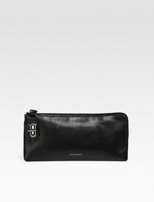 An ultra-thin shape of luxe leather for your on-the-go essentials. Top zip closure with a signature t-pin turnlockOne inside zip pocketTwo inside open pocketsFour inside credit card slotsLeather lining9W X 4½H X ¾DImported An ultra-thin shape of luxe leather for your on-the-go essentials. Top zip closure with a signature t-pin turnlockOne inside zip pocketTwo inside open pocketsFour inside credit card slotsLeather lining9W X 4½H X ¾DImported