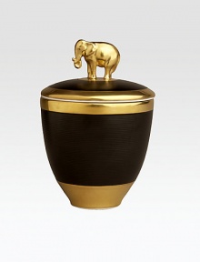 A candle with the intoxicating scent of pink champagne, encased in handcrafted, fine Limoges porcelain with 14k goldplated accents. Includes a fitted lid with a clasp sculpted in the shape of an elephant on an island of 14k gold. Handcrafted porcelain 5½H X 5 diam. Imported A candle with the intoxicating scent of pink champagne, encased in handcrafted, fine Limoges porcelain with 14k goldplated accents. Includes a fitted lid with a clasp sculpted in the shape of an elephant on an island of 14k gold. Handcrafted porcelain 5½H X 5 diam. Imported