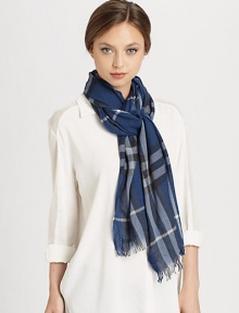 A bold check design with fringe trim on a crinkled cashmere and wool blend.55% merino wool/45% cashmere17.7 X 78.7Dry cleanMade in the United Kingdom A bold check design with fringe trim on a crinkled cashmere and wool blend.55% merino wool/45% cashmere17.7 X 78.7Dry cleanMade in the United Kingdom