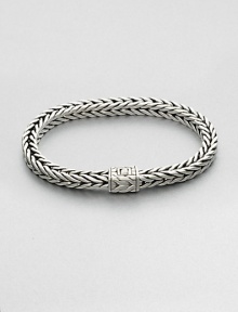 Small sterling silver bracelet in a squared, rope-weave pattern resembling herringbone, with push-lock closure.Sterling silverAbout 3 diam.Imported Small sterling silver bracelet in a squared, rope-weave pattern resembling herringbone, with push-lock closure.Sterling silverAbout 3 diam.Imported
