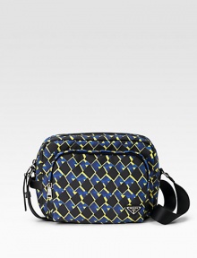 A vivid pattern in rugged, beautifully crafted nylon with leather trim and logo plate detail. Zip closure Front, interior zip pockets Adjustable shoulder strap Nylon lining 11¾W X 8½H X 4¼D Imported A vivid pattern in rugged, beautifully crafted nylon with leather trim and logo plate detail. Zip closure Front, interior zip pockets Adjustable shoulder strap Nylon lining 11¾W X 8½H X 4¼D Imported
