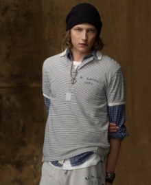 A preppy polo is transformed with weathered stripes and naval-inspired graphics for a vintage-inspired look that is ruggedly hip.