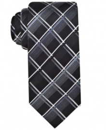 A funky grid pattern gives this silk tie from Alfani a uniquely handsome look. A funky grid pattern gives this silk tie from Alfani a uniquely handsome look.