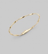 Simply stunning, this 18k gold bangle with delicate ridges and twists is great on its own, even better when stacked in multiples. 18k goldDiameter, about 2½Tongue-and-groove claspImported Please note: Bracelets sold separately. 