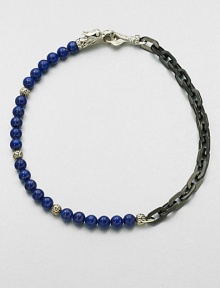 A brilliant strand of smooth lapis beads joins together with intricate links of sterling silver and stainless steel, and is finished with a sculpted sterling silver clasp.LapisSterling silver/stainless steelAbout 3 diam.Imported A brilliant strand of smooth lapis beads joins together with intricate links of sterling silver and stainless steel, and is finished with a sculpted sterling silver clasp.LapisSterling silver/stainless steelAbout 3 diam.Imported