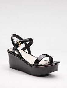 Patent leather open toe wedge with adjustable ankle strap.Self-covered wedge heel, 3 (75mm) Self-covered platform, 1¾ (45mm) Compares to a 1¼ heel (30mm) Leather lining Rubber sole Padded insole Made in ItalyOUR FIT MODEL RECOMMENDS ordering true size. 