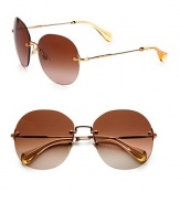 Timeless sunglasses in a retro rimless design with requisite logo temples. Available in bronze with brown gradient lens or black with grey gradient lens.Gold-tone metal logo templesUV400 protectionMade in Italy 