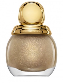 The whimsical and playful masquerade balls of his time, embodied Christian Dior's love of surprise and elegance. Today, the House of Dior embodies that same sense of extravagant splendor with a golden holiday collection of limited edition items. Diorific Vernis Nail Lacquers are vibrant, high-shine nail lacquers encased in precious glass bottles accented with gold toppers. They leave your nails perfectly polished for the Dior Grand Ball. 